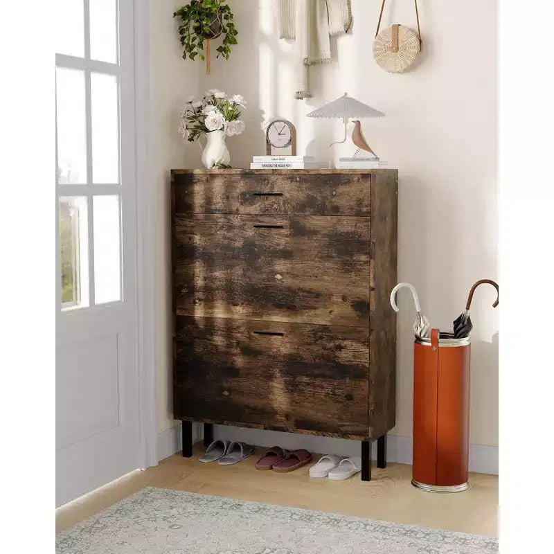 Slim three-tier shoe cabinet with double flip-up drawers adjustable shelves, concealed shelving, space-saving design.